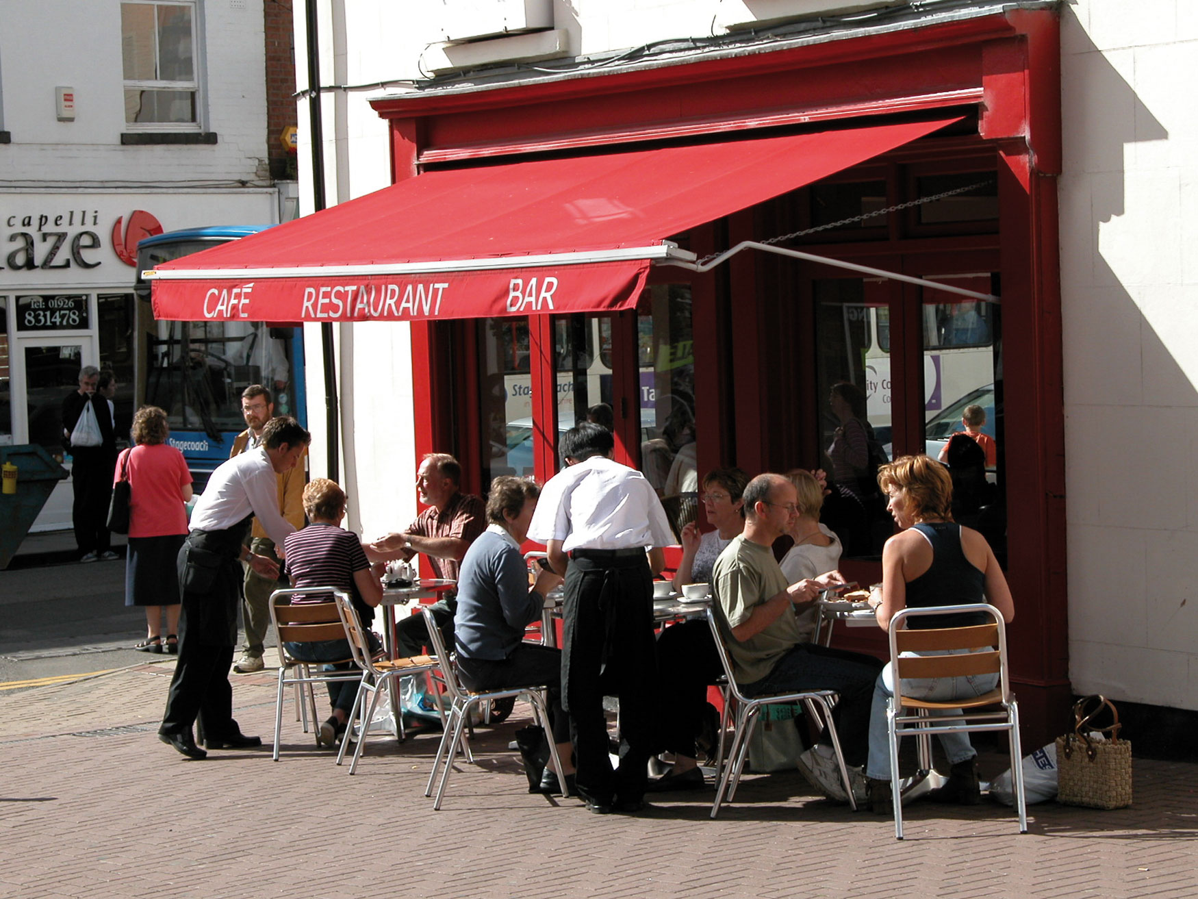 retail and cafes or restaurants insurance,cafe, rouge in high street shown with outside tables being served